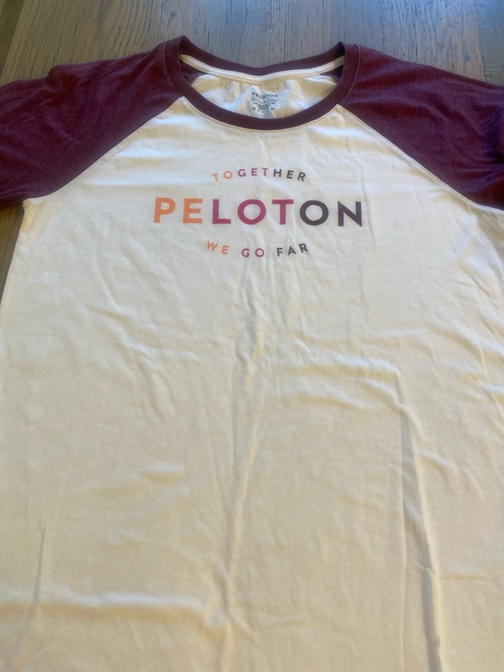 Worn just 1 time! Peloton White 3/4 length Tee with Burgundy Raglan Sleeves